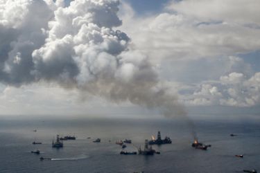 Smoke rises from the BP oil spill site, as natural gas is burned off, while the drilling of two relief wells continue in the Gulf of Mexico, July 4, 2010. A commission appointed