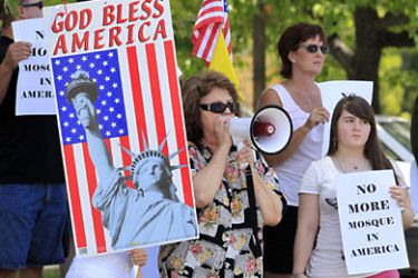 r_Local citizens protest across the street from a business warehouse where the Islamic Center of Temecula Valley currently hold their services in Temlecula, California July 30