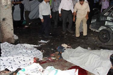 f_Bodies are strewn outside the Jameh mosque in the southeastern Iranian city of Zahedan on July 15, 2010. Two suicide bombings at a Shiite mosque in heavily Sunni