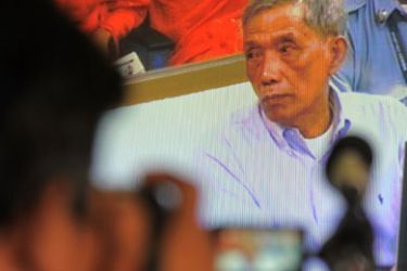 July 26, 2010, showing a live video of former Khmer Rouge prison chief of S-21, Kaing Guek Eav, also known as Duch, sitting in the dock during the reading of the verdict in his trial for crimes against humanity, war crimes, torture and premeditated murder