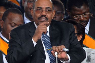 f_Sudanese President Omar Hassan al Bashir gestures during the ceremony of promulgation of Kenya's New Constitution at the Uhuru Park grounds on August 27, 2010