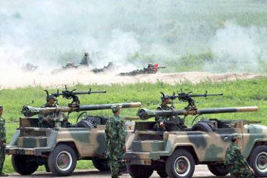 This file photo taken on July 10, 2002 shows soldiers from China's People's Liberation Army (PLA) Brigade 196 showing off their firepower during a display at their training camp in Yangcun, about 100 kilometres southeast of Beijing.