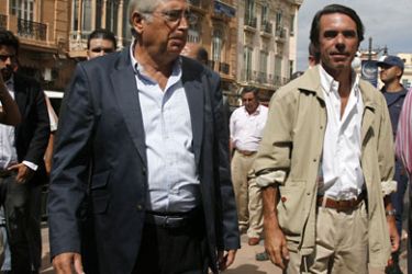 Spain's former Prime Minister Jose Maria Aznar (R) and the President of the Autonomous City of Melilla Juan Jose Imbroda (L) walk in the streets of Spain's tiny north African enclave of Melilla during a surprise visit on August 18, 2010