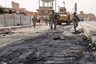 US soldiers patrol near the site of a suicide attack in Ramadi, west of Baghdad, on August 8, 2010