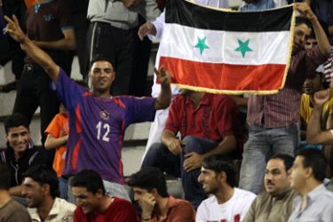 Supporters of the Syrian soccer team chant during their match against Kuwait in the Sixth 2010 WAFF Championship (West Asian Football Federation Championship) in Amman, on September 26, 2010