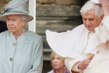 Pope Benedict XVI (R) replaces his 'zucchetto' as he meets with Britain's Queen Elizabeth II at the Palace of Holyroodhouse in Edinburgh, Scotland, on September 16, 2010. Pope Benedict XVI arrived in Britain on Thursday at the start of an historic four-day state visit, after admitting the Catholic Church had not been vigilant enough on paedophilia.