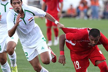 Iran's Milad Midavudi (19) vies for the ball against an Iraqi player Mohammed Karim (2) in the semi-finals of the Sixth 2010 WAFF Championship (West Asian Football Federation) football match in Amman on October 01, 2010. AFP