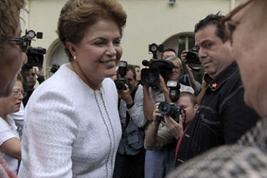 : Dilma Rousseff (C), presidential candidate for the ruling Workers' Party (PT), arrives at a maternity hospital as she campaigns in Sao Paulo, Brazil, on October 9, 2010