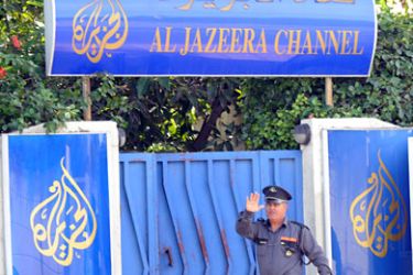 A security guard stands in front of the headquarters of Al-Jazeera's television news channel in Rabat on October 29, 2010. Morocco has suspended the operations of the Qatar-based Al-Jazeera television news channel in Rabat and withdrawn the accreditations of its staff, the commmunications ministry said on October 29, 2010. The ministry said the sanctions followed "numerous failures in (following) the rules of serious and responsible journalism." AFP PHOTO / ABDELHAK SENNA