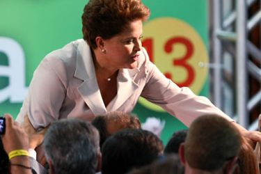 Brazilian President elect Dilma Rousseff shakes hands with suporters after delivering a speech in celebration of her victory at a hotel in Brasilia, on October 31, 2010. Rousseff has become the first female President of Brazil, after early results showed her receiving 56% of votes against 43% received by her rival, candidate for the Brazilian Social Democratic Party (PSDB), Jose Serra