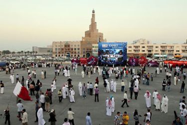 Qataris and foreigners gather at Doha's traditional souk to follow FIFA's decision on who will host the 2022 World Cup on December 2, 2010