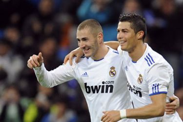 Real Madrid's Karim Benzema (L) celebrates his goal with teammate Cristiano Ronaldo during their Spanish King's Cup soccer match at Santiago