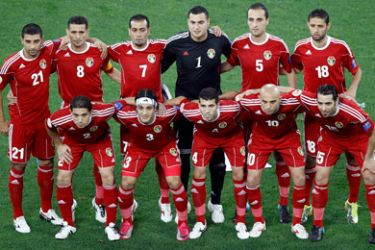 Jordan's national soccer team line up for a team picture before their 2011 Asian Cup quarter-final soccer match against Uzbekistan at Khalifa stadium in Doha January 21, 2011.