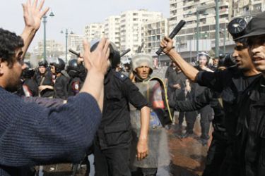 Egyptian demonstrators confront riot police during a protest in Cairo on January 28, 2011, demanding the ouster of President Hosni Mubarak 82-years-old, who has held on to power for more than three decades.