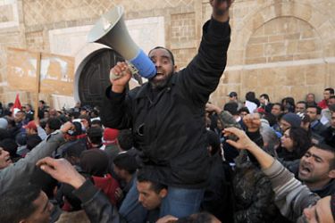 Inhabitants of the central Tunisia region of Sidi Bouzid chant slogans during a demonstration in front of the Government palace inTunis on January 23, 2011. The protestors came from a poverty-stricken rural region where the crackdown against a wave of social protests in the final days of ousted president Zine El Abidine