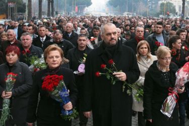 Albania's main opposition Socialist Party leader Edi Rama (C), leads opposition supporters during a march in honour of three people killed during an anti-government demonstration. Albanian opposition leader Edi Rama vowed to push on with protests despite the government's accusations that they are staging a coup after three people were killed in clashes a day earlier.