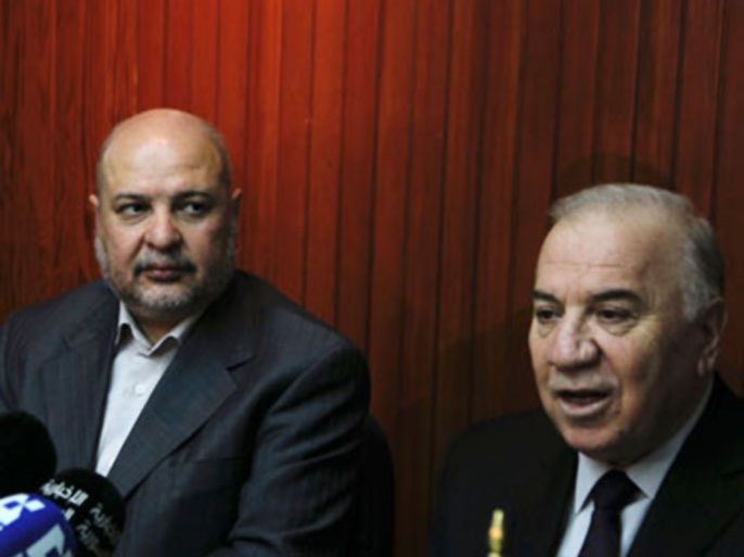 Syria's Oil Minister Sufian Alao (R) speaks as Iran's Oil Minister Masoud Mir-Kazemi looks on during their meeting in Damascus January 18, 2011. Syria and Iran announced they will start studies about the Foroklos oil refinery located in Syria, and discuss the establishment of a gas pipeline between the two countries.
