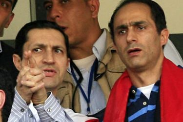 (FILES) -- In a picture taken on January 31, 2010, Alaa (L) and Gamal Mubarak, sons of Egyptian president Hosni Mubarak, attend their national team final match against Ghana in the African Cup of Nations CAN2010 in Luanda. Egypt's 82-year-old president stepped down on February 11, 2011 and handed power to the Supreme Council of the Armed Forces, Vice President Omar Suleiman said in a brief televised statement. AFP