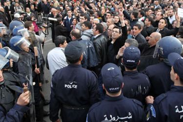 Algerian protesters chant slogans during a demonstration on 12 February 2011 in Algiers,Algeria demanding the departure of Algerian President Abdelaziz Bouteflika EPA/MOHAMED MESSARA