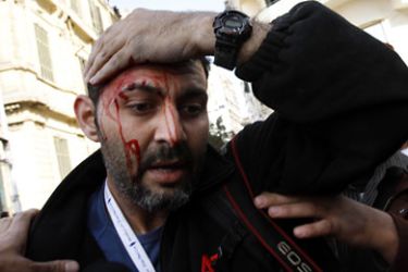 Injured AP news agency photographer Khalil Hanna is seen during clashes between anti-government demonstrators and their pro-government opponents in Cairo's Tahrir square on February 03, 2011 on the 10th day of protests calling for the ouster of embattled President Hosni Mubarak. AFP