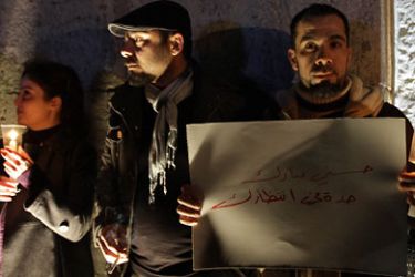 Syrians hold candels during a sit-in at Bab Tuma in old Damascus