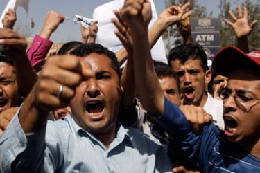 Anti-government protesters shout slogans in Sanaa February 19, 2011. An anti-government protester was killed and seven injured in clashes with supporters of Yemen's President Ali Abdullah Saleh in Sanaa on Saturday, a day after five people died in protests against his 32-year rule.