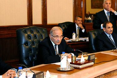 epa02568954 Newly appointed Egyptian Prime Minister Ahmed Shafik (2L) is seen during a cabinet meeting in Cairo, Egypt, 07 February 2011. Despite the protests that entered the 14th consecutive day on Monday, the Egyptian government, according to media reports, for now is sticking to its position that president Hosni Mubarak will leave in