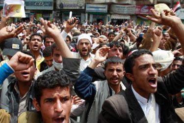 Anti-government protesters shout slogans during a rally demanding the ouster of Yemen's President Ali Abdullah Saleh in Sanaa March 19, 2011. Two prominent members of Yemen's ruling party resigned on Saturday in protest against the killing of dozens of anti-government protesters, while troops enforced a state of emergency in the capital.
