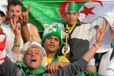 Algerian soccer fans cheer for their team at a 2012 African Cup of Nations qualifying match against Morocco, in Annaba, on March 27, 2011.