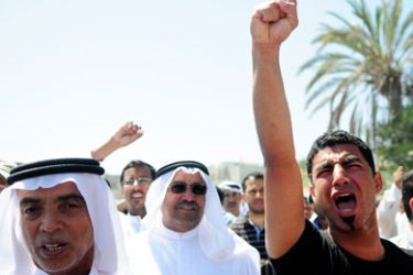 A man shouts anti-government slogans during the funeral of Isa Abdul Ali Radhi in Sitra March 20, 2011. Isa, 47, died of wounds sustained in clashes with security forces in Sitra on Wednesday.