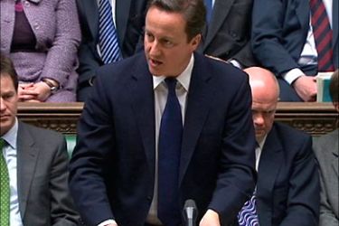 r_Britain's Prime Minister David Cameron, addresses the House of Commons, in central London March 18, 2011. Cameron made a statement to parliament on Libya on Friday after the United Nations authorised military attacks on Libyan leader Muammar Gaddafi's forces. REUTERS