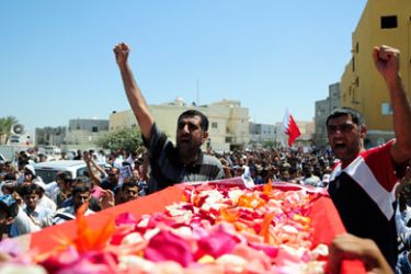 Mourners shout anti-government slogans during the funeral of Isa Abdul Ali Radhi in Sitra March 20, 2011. Isa, 47, died of wounds sustained in clashes with security forces in Sitra on Wednesday.
