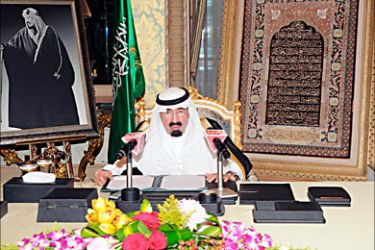 r_Saudi King Abdullah address the nation from his office at the Royal Palace in Riyadh March 18, 2011. Saudi King Abdullah announced on Friday billions of dollars