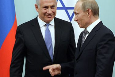 Russian Prime Minister Vladimir Putin (R) welcomes Israeli Prime Minister Benjamin Netanyahu during their meeting in Moscow on March 24, 2011