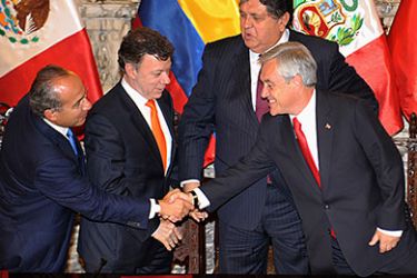 L-R) Presidents Felipe Calderon of Mexico, Juan Manuel Santos of Colombia, Alan Garcia of Peru and Sebastian Piٌera of Chile, congratulate each other after signing the document creating the Lima Accord during a ceremony at the presidential Palace in Lima on April 28, 2011. The presidents signed an ambitious trade agreement aimed at strengthening commercial ties and forging a common strategy to access