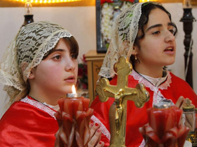 Iraqi Christians attend an Easter mass at Chaldean Catholic church in Amman April 24, 2011. Thousands of Iraqi Christians fled to neighbouring Jordan following a spate of bombings that targeted churches in Iraqi cities in the past few years.
