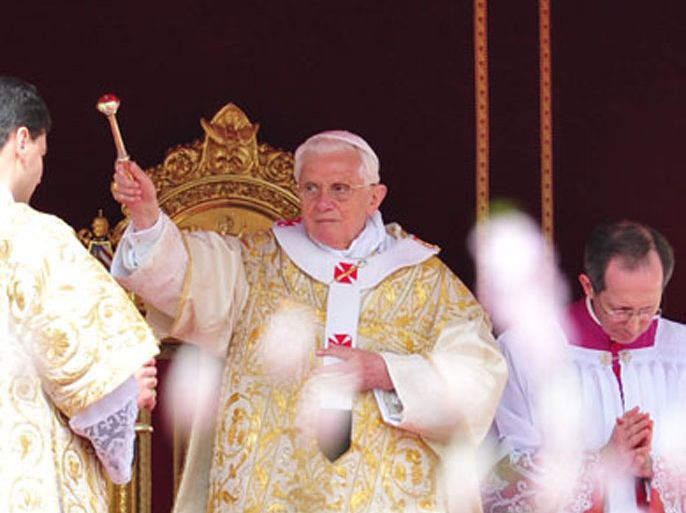 Pope Benedict XVI (C) celebrates the Easter Holy Mass on April 24, 2011 at St Peter's square at The Vatican. Later in the day, the pontiff will deliver the Urbi and Orbi message and blessing.