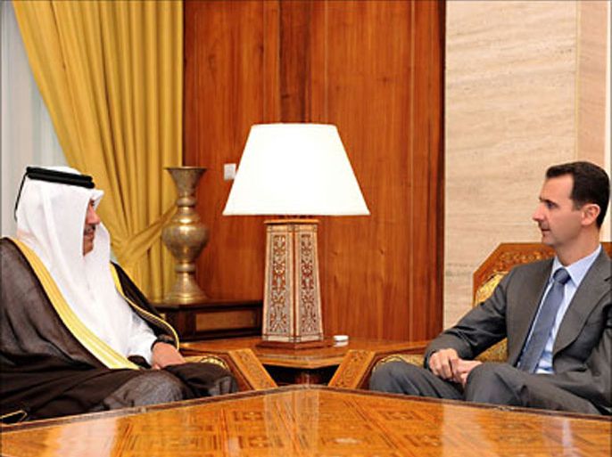 f_A handout picture released by the Syrian Arab News Agency (SANA) shows Syrian President Bashar al-Assad (R) speaking with Qatari Premier and Foreign Minister Sheikh