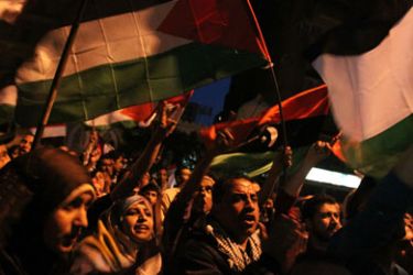 Egyptian protesters wave Palestinian flags as they gather outside the Israeli embassy in Cairo on April 8, 2011 to protest against the Israeli strikes on the neighbouring Gaza Strip, which have killed 14 people in the past 24 hours.