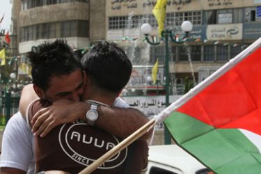 Palestinians celebrate during a rally in the West Bank city of Nablus on May 04, 2011 as Palestinians in the West Bank and Gaza Strip gather to welcome a reconciliation deal signed by rival movements Hamas and Fatah in Cairo