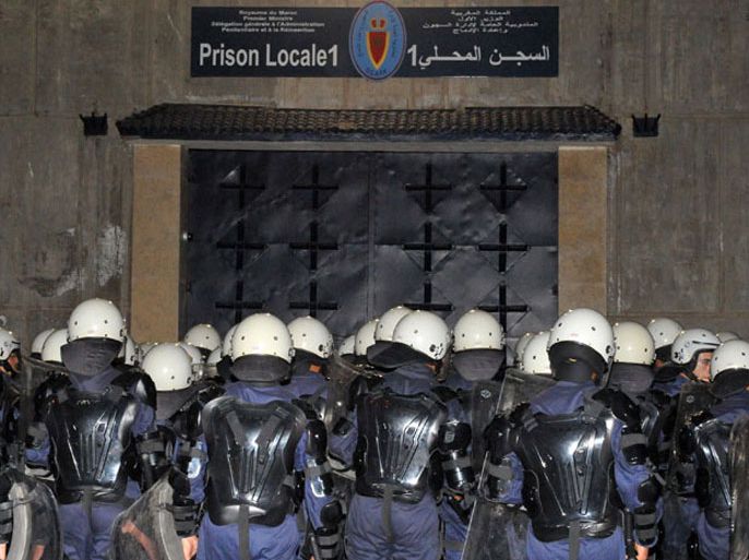 Moroccan police officers wait in front of a detention center in Sale, near Rabat, as prisoners gathered to protest against their detention conditions on May 17, 2011. Moroccan authorities used tear gas to put down the prison protest by accused Islamist militants.