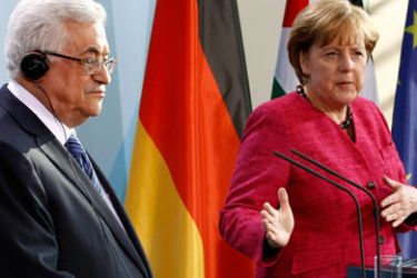 German Chancellor Angela Merkel (R) and Palestinian President Mahmoud Abbas attend a joint news conference after talks at the Chancellery in Berlin May 5, 2011.