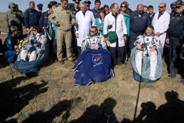 (R-L) Italian astronaut Paolo Nespoli, Russian cosmonaut, the Expedition 27 Commander Dmitry Kondratyev and US astronaut, flight engineer Catherine "Cady" Coleman rest in rocking chairs shortly after their landing in Soyuz TMA-20 capsule about 150 km south-east of the Kazakh town of Jezkazgan on May 24, 2011. A Soyuz space capsule carrying an Italian, a Russian and an American back from the International Space Station (ISS) has landed safely in Kazakhstan, Russian mission control said.
