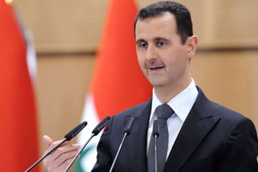 f_A handout picture released by the official Syrian Arab News Agency (SANA) shows Syria's President Bashar al-Assad addressing the nation from Damascus University in the