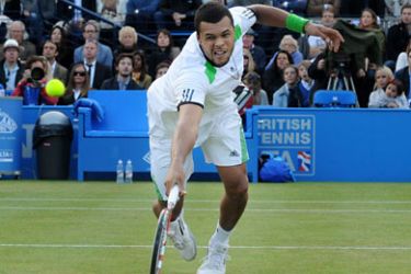afp-Wilfred Tsonga of France dives to return the ball during his match against Spain's Rafael Nadal