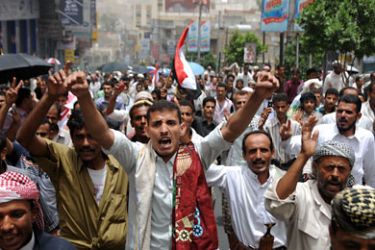 Yemeni anti-government protesters demand the ouster of their president in the southern city of Taiz on July 22, 2011.