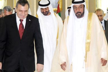 A handout picture released by the United Arab Emirates official photo agency WAM on July 4, 2011 shows Emirati President Sheikh Khalifa bin Zayed bin Sultan al-Nahyan walking along side Egyptian Prime Minister Essam Sharaf (L) at the Mina Palace in Abu Dhabi.
