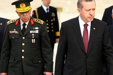 : This photograph taken on November 30, 2010, shows Chief-of-staff General Isik Kosaner (L) standing next to Turkish Prime Minister Tayyip Erdogan as they attend a wreath-laying ceremony with members of the High Military Council, in Ankara.