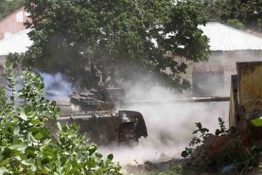 r_A tank from the peacekeepers unit of the African Union Mission to Somalia (AMISOM) fires into Islamists insurgents' positions in Wardhiiglay district, south of capital Mogadishu July 29, 2011. REUTERS