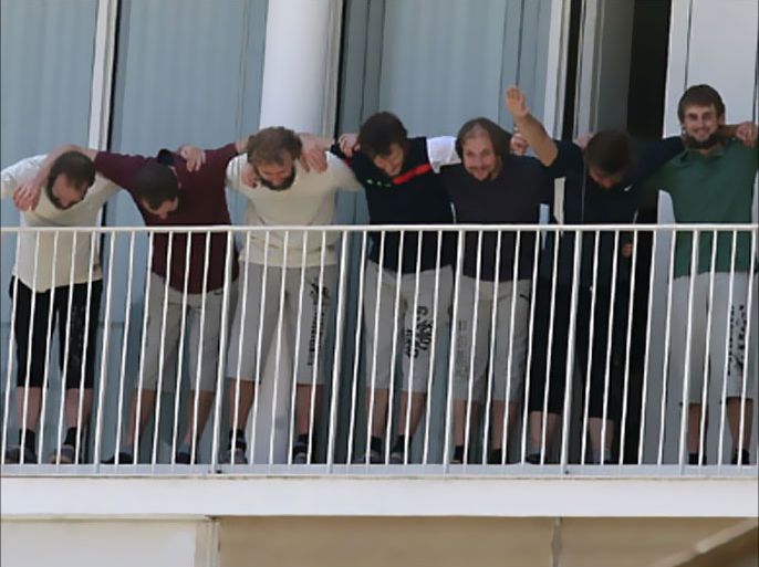 Seven Estonian cyclists who were kidnapped in March make their first public appearance on the balcony of the French embassy in Beirut on July 14, 2011 hours after they were freed from their abductors in the eastern Bekaa Valley.